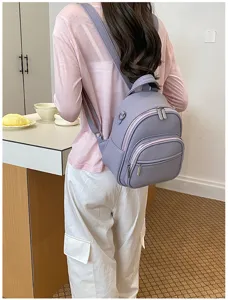 Detail view of a casual women's backpack in light purple, showcasing its practical daily wear style.