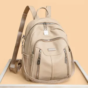Women PU leather casual backpack, multi-pocket stylish travel daypack in beige color.