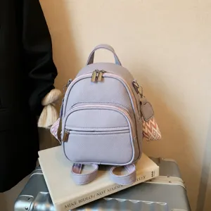 Women casual purple mini backpack stylish PU leather double shoulder bag for daily commute.