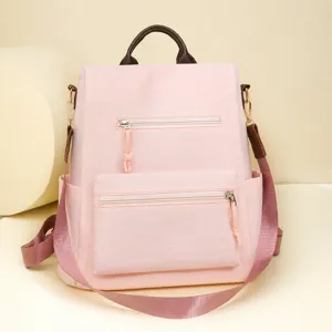 Stylish pink casual backpack for women, large capacity multi-pocket travel daypack.