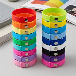 Silicone wristbands colorful stack detail shot showing metal snap buttons and bright hues