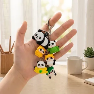 Cute multi-pendant panda keychain with soft silicone figures and metal lobster clasp for bags.