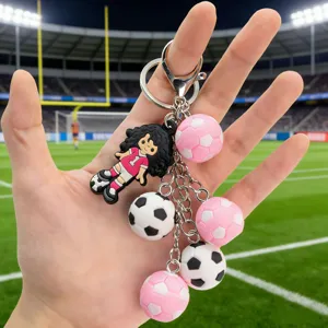 3D cartoon soccer girl and ball keychain detail showing metal lobster clasp and cute charms.