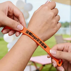 Custom silicone sports wristband with printed logo text, perfect for events and fan support.