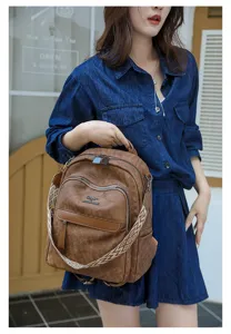 Sac à dos vintage pour femme en cuir souple avec sangle large, grand sac décontracté pour voyage.