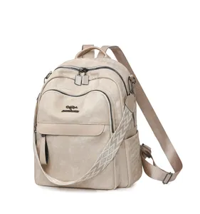 Sac à dos rétro pour femme en cuir souple avec grande capacité et sangle géométrique stylée.