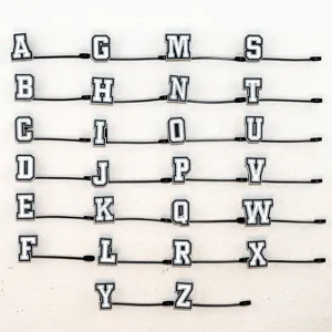 Detailed view of custom alphabet silicone straw charms, letters A to Z straw cover rings.