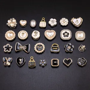Assorted black and white camellia pearl shoe charms set for stylish clogs and bags