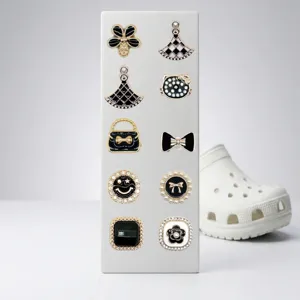Black and white metal pearl shoe charms for clogs, stylish bow and flower design accessories.