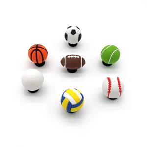 Detailed close-up view of diverse 3D sports ball shoe charms, perfect for clogs decoration.
