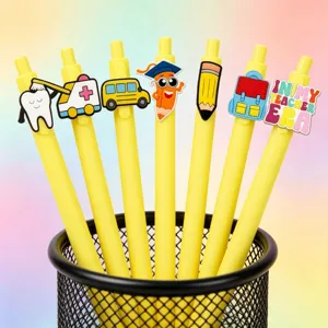 Joli ensemble de stylos gel jaunes de dessin animé avec breloques PVC pour les élèves.