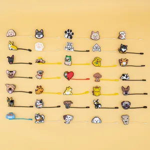 Cute silicone straw covers and dust plugs with assorted cartoon dog designs for party decor.