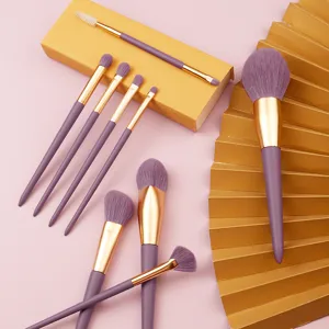 Purple makeup brush set with soft synthetic fibers and gold handles for daily eye and face beauty.