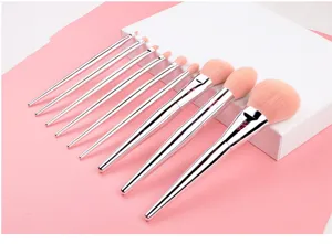 Detailed view of the 9-piece makeup brush set with pink fibers and shiny silver handles.