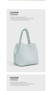 Detailansicht der mintgrünen Taschen aus genarbtem Leder mit elegantem geflochtenen Henkel.