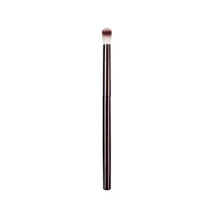 Professional makeup brush highlighter and blending brush with a sleek metallic handle for precision.