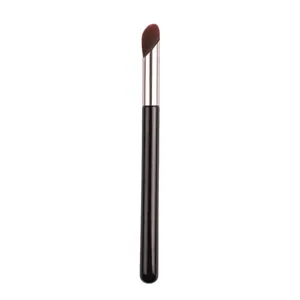 Seamless thumb concealer brush with synthetic fiber bristles and wooden handle for makeup.