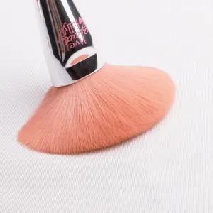 Professional pink fan makeup brush with soft synthetic fibers and durable metal handle.