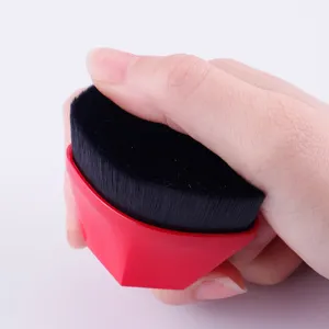 Professional 55 petal foundation makeup brush with dense black bristles and ergonomic red handle.