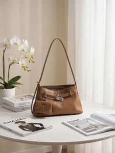 Top layer cowhide shoulder crossbody tote bag with chic lock design, versatile fashion style.