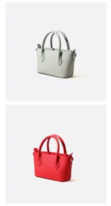 Minimalistische rundleren handtas detailweergave, stijlvol ontwerp in twee kleuren.