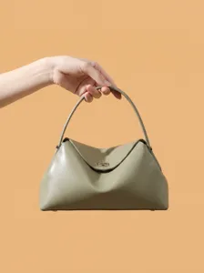 Elegant green leather handbag for women, chic commuter shoulder bag with top handle design.