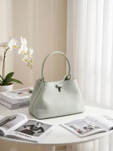 Borsa a mano in pelle verde chiaro granata secchiello borsa minimalista chic