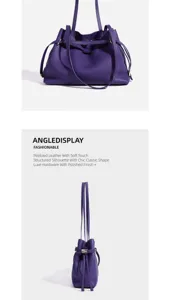 Detailed view of purple pebbled leather bucket bag with structured silhouette and hardware.