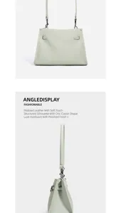 Dettaglio borsa a tracolla in pelle martellata, borsa chic minimalista con finiture metalliche lucide.