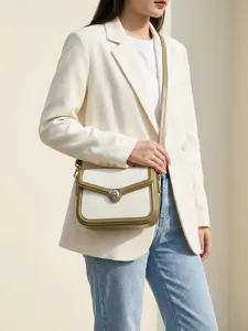 Elegante Damen Umhängetasche aus Leder mit modischem Farbdesign und Retro-Drehverschluss.