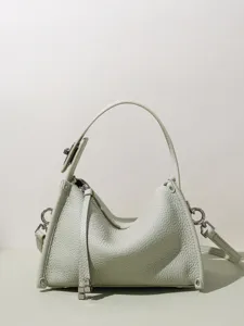 Borsa a tracolla in pelle verde chiaro, elegante borsa di design con manico e tracolla.