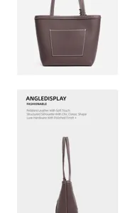 Detailed view of the pebbled leather tote bag showcasing contrast stitching and hardware.