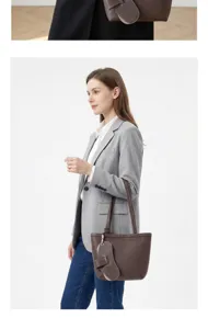 Brown leather tote shoulder bag with spacious capacity, classic bucket shape, and stylish design.