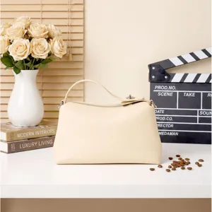 Beige genuine leather shoulder bag for women, minimalist top handle handbag daily use.