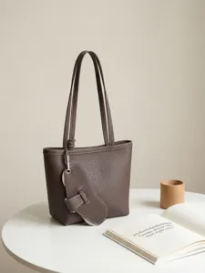 Minimalist brown leather tote bag for women, large capacity stylish commuter shoulder bag.