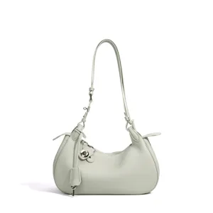 Sac bandoulière minimaliste en cuir vert menthe, sac croissant chic pour un usage quotidien.