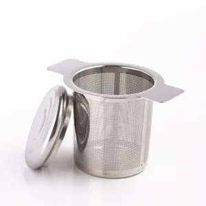 Stainless steel tea strainer detail featuring fine mesh, dual handles, and lid for tea.