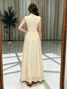 Elegant sleeveless mesh long evening dress with pleated waist and flared hem for women.