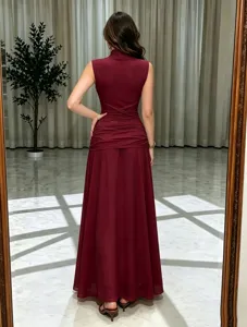 Sleeveless mesh long evening dress in burgundy, featuring a draped waist and elegant flare.