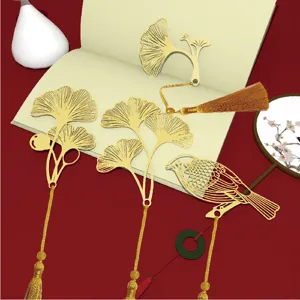 Classical Chinese style metal hollow bookmark set with ginkgo leaf and bird design and tassels.