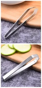 Stainless steel kitchen tweezer detail shot, precise slanted tip for fish bone hair plucking.
