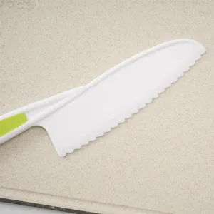 Child safe plastic serrated kitchen knife detail view, ideal for kids baking and cutting food securely.