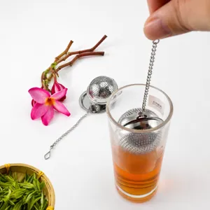 Stainless steel tea infuser ball with chain and hook for easy brewing in cups or teapots.