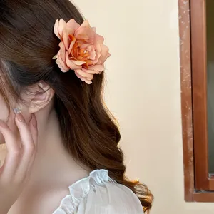 Peach rose fabric hair clip detail, sweet floral hair accessory for spring and summer daily wear.
