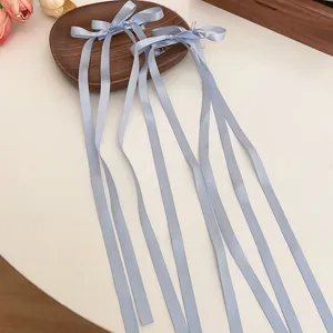 Pinza de pelo con lazo de raso azul claro cinta larga estilo dulce para uso diario.