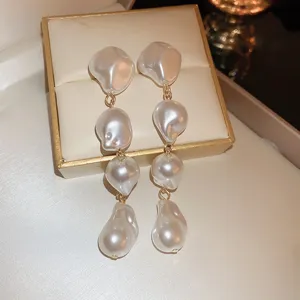 Elegant irregular baroque pearl long dangling earrings, retro Korean style fashion jewelry for women.