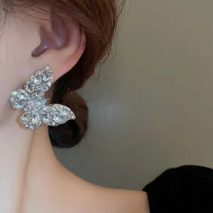 Elegant crystal butterfly earrings featuring sparkling zircon stones for stylish women and girls.