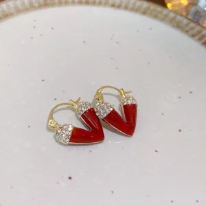 Elegant red enamel rhinestone V-shaped fashion earrings, exquisite detail shot for daily wear.