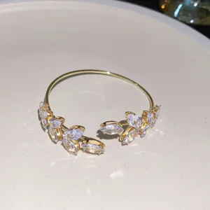 Gold-plated cuff bracelet featuring sparkling marquise crystal leaves, elegant and stylish.