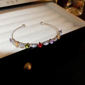 Exquisite multi-color crystal open cuff bracelet, elegant silver tone jewelry detail view.